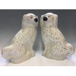 A pair of Staffordshire fireside dogs, heights 39cm.
