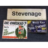 A selection of various advertising signs and posters, including Stevenage train station sign,