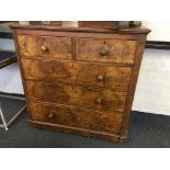 A Victorian mahogany chest of drawers with walnut front and three long and two short drawers.