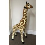 A Melissa & Doug soft toy giraffe, height approximately 136cm.