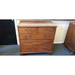 An oak three long and two short drawers chest on bracket feet.