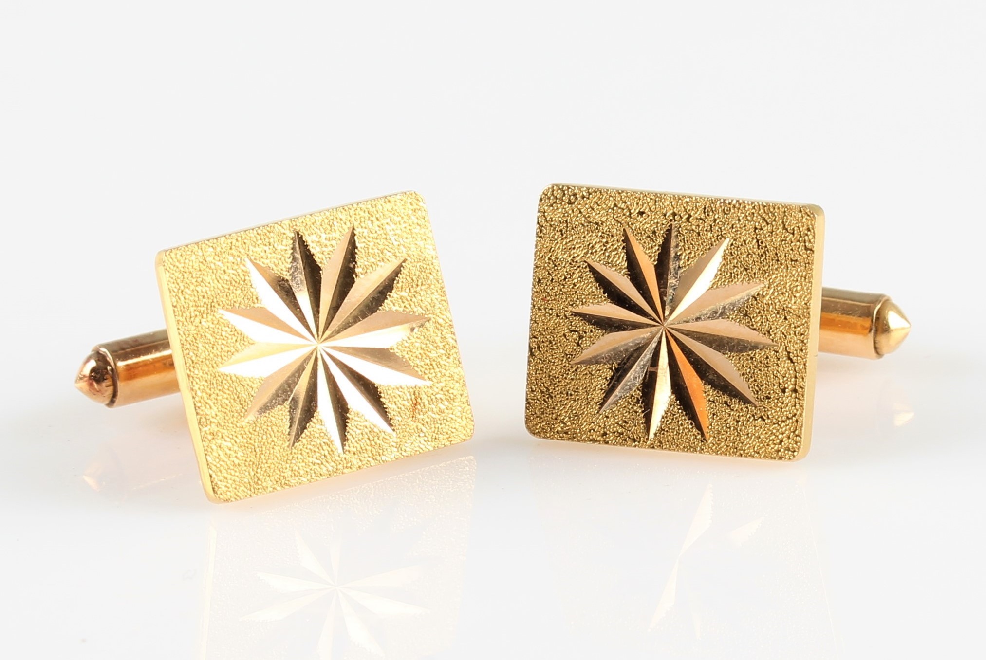 A pair of rectangular bright cut engraved cufflinks, both stamped 22K with additional Chinese