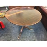 A mahogany round topped single column table.