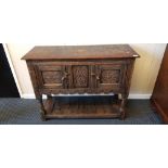 A reproduction distressed oak two-door cupboard base.