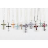 A lot to include ten gemstone set cross pendants, including Jade, Tulelei, topaz, andesine,