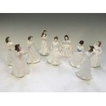 Nine Royal Doulton half size figurines including Joy, Charmed, Greetings, Harmony, Amanda, etc.
