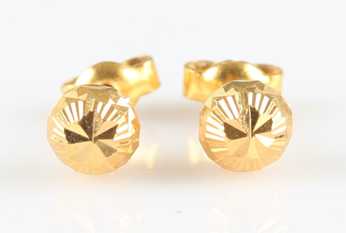 A pair of bright cut engraved sphere earrings, unmarked yellow metal.