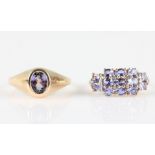 Two hallmarked 9ct yellow gold tanzanite rings, one being set with a single stone, the other set