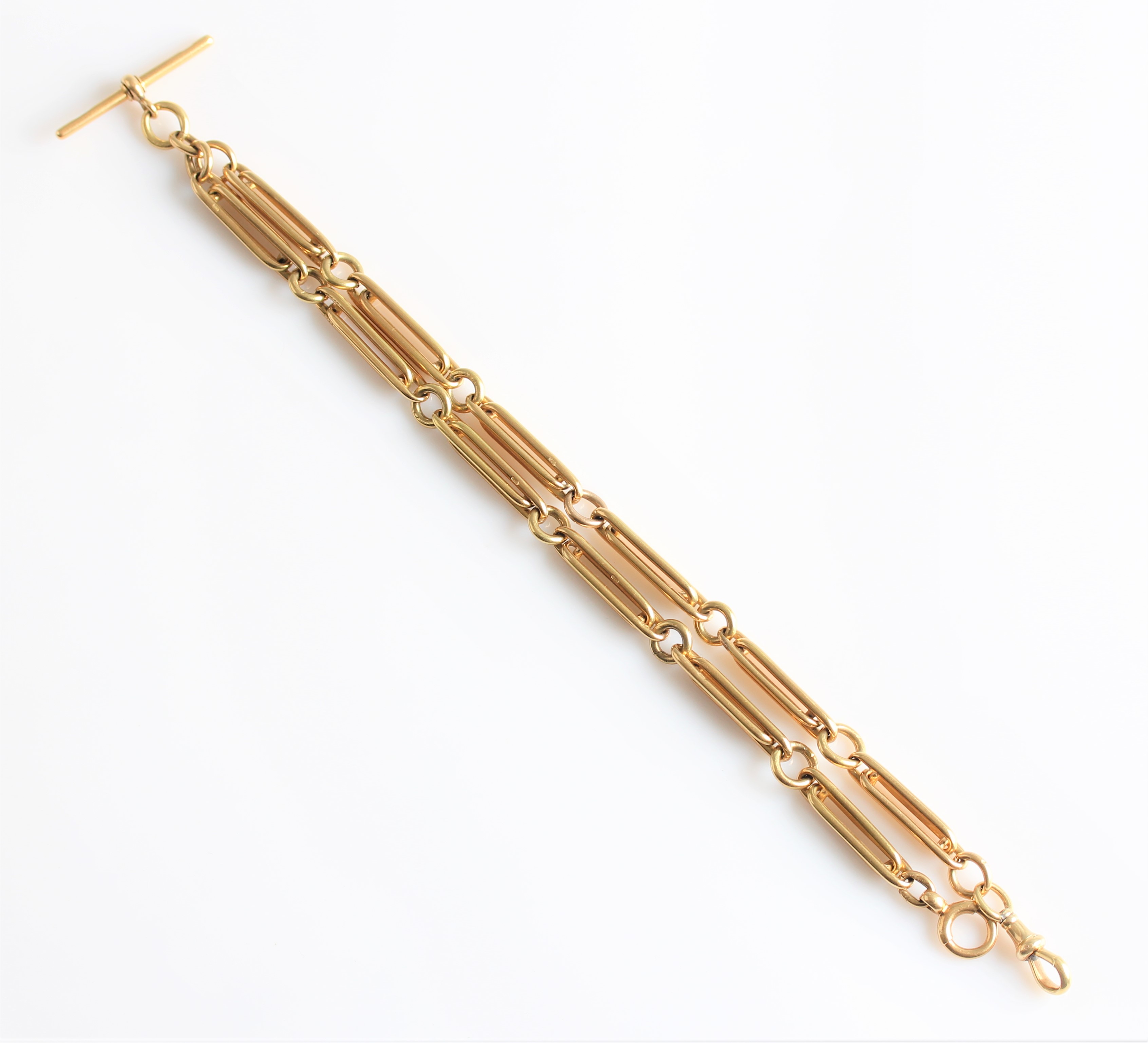 An 18ct yellow gold fancy belcher link double Albert watch chain, with T-bar, a spring ring and