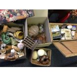 Four boxes containing decorative items, to include glass clam lampshades, carnival glass, two