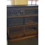 An oak three lead-glazed door Globe Wernicke style bookcase.