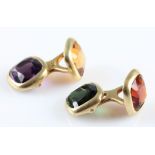 A pair of gemstone set cufflinks, set with cushion cut pieces of amethyst, citrine, tourmaline and a