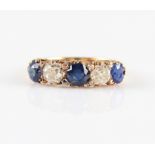 A late 19th / early 20th Century sapphire and diamond five stone ring, set with three round cut