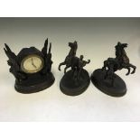Three bronze finished figurine groups, including clock with winged sphinxes and two men with