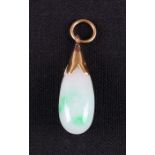 A green jadeite jade tear drop pendant, unmarked yellow metal mount, length approx. 3.5cm.