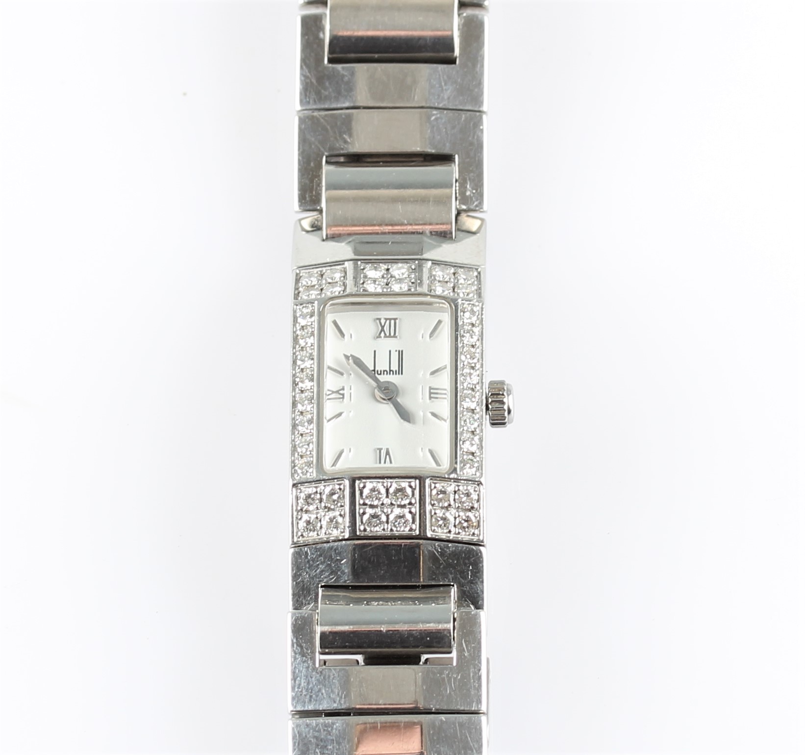 A ladies stainless steel quartz Dunhill wrist watch, the white dial having hourly baton markers