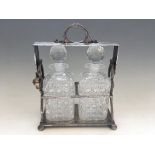 A silver plate two decanter tantalus.