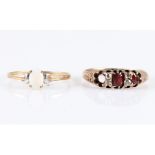A lot to include an opal single stone ring, stamped 9ct, together with a garnet and diamond ring (