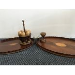 Two mahogany trays with inlay designs, together with a timer and an egg stand, with six cups and six