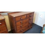 A mahogany three long and two short drawers chest on bun feet.