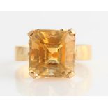 A single stone citrine ring, set with an emerald cut citrine, measuring approx. 9x9mm, stamped