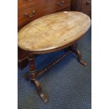 A walnut inlaid table, together with a mahogany swing mirror.