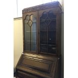 *An oak bureau with lead glazed top.