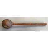 A Fijian Ula throwing club, with carved zig zag and stripe pattern to handle and pierced base,