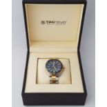 *A Tag Heuer Formula 1 gents wrist watch, the blue dial having hourly baton markers with date