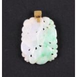A green/white jadeite jade pendant, carved with floral and foliage design, yellow metal pendant