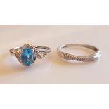 *Two hallmarked 9ct white gold rings, one being set with a principal oval cut blue topaz with