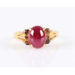 A ruby single stone ring, set with an oval ruby cabochon, measuring approx. 9x6mm, stamped with