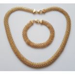 *A part-suite of 9ct yellow gold jewellery, comprising a necklet and bracelet of mesh link
