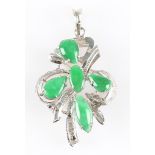 A green jadeite jade pendant, the open metalwork design set with five cabochons of jadeite,