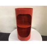 A Tomtom red painted cylindrical bedside cabinet. IMPORTANT: Online viewing and bidding only. No
