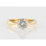 A hallmarked 18ct yellow gold diamond solitaire ring, set with a round brilliant cut diamond,