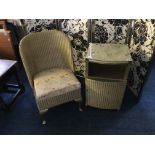 A Lloyd Loom chair with glass topped single door cupboard. IMPORTANT: Online viewing and bidding