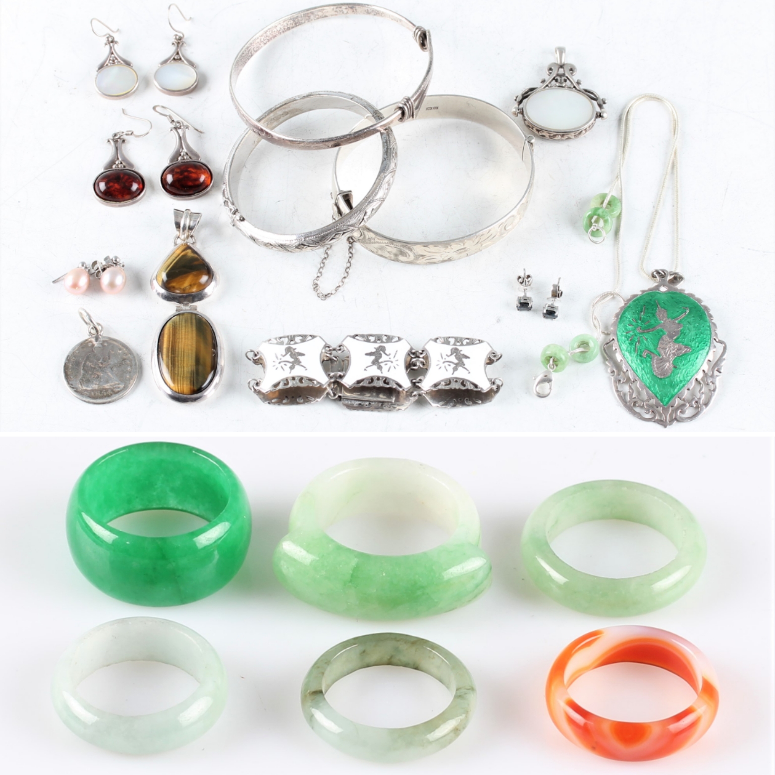 A collection of six stone band rings, five being green hardstones and the other being banded