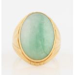 A green jadeite jade ring, set with an oval jadeite cabochon, measuring approx. 22x16mm, metalwork