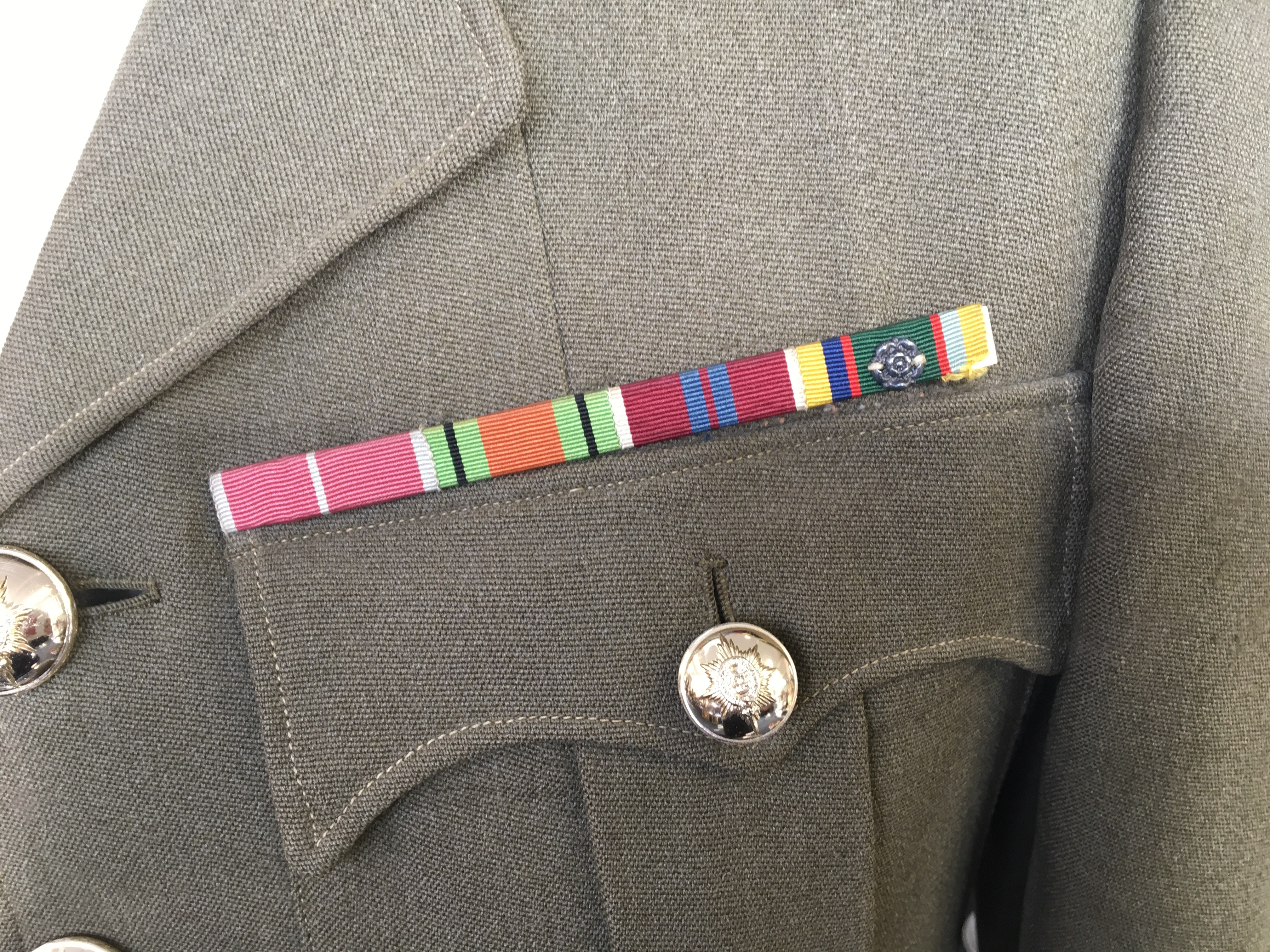 A World War Two Warwickshire regiment jacket with ribbons together with ...