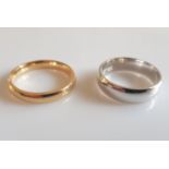 *A hallmarked 18ct yellow gold plain wedding band, ring size M, together with a hallmarked 9ct white