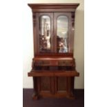 A 19th century mahogany cylinder secretary bookcase, height 202cm, width 95cm, depth 50.5cm.