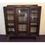 An oak glazed three door bookcase. IMPORTANT: Online viewing and bidding only. No in person