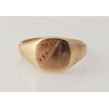 A 9ct yellow gold gents signet ring, the cushion shaped head diagonally engraved with scroll design,
