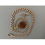 A 9ct Albert chain with 9ct T bar and fob. Total weight 62 grams including fob. IMPORTANT: Online