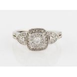 *A hallmarked 9ct white gold diamond ring, set with a principal round brilliant cut diamond,