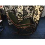 A green upholstered bentwood rocking chair. IMPORTANT: Online viewing and bidding only. No in person