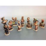 Twelve Goebel Hummel figures, one AF. IMPORTANT: Online viewing and bidding only. No in person