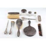 A collection of hallmarked silver dressing table pieces, to include a comb, a shoe horn, a button