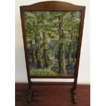 Five framed wool work tapestries together with a wool work fire screen with forest scene. IMPORTANT: